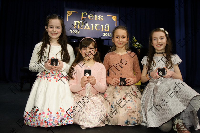 Feis27032018Tue13 
 13
Three Joint Bronze Medallists Leah Sweeney, from the City Centre; Abigail Adair from Carrigtwohill and Sophie Hennessy from Killshanna with Silver Medallist Jill Cleary from Kilshanna.
 Singing Class: 55: Girls Solo Singing 9 Years and Under Feis Maiti 92nd Festival held in Fr. Mathew Hall. EEjob 27/03/2018 Picture: Gerard Bonus