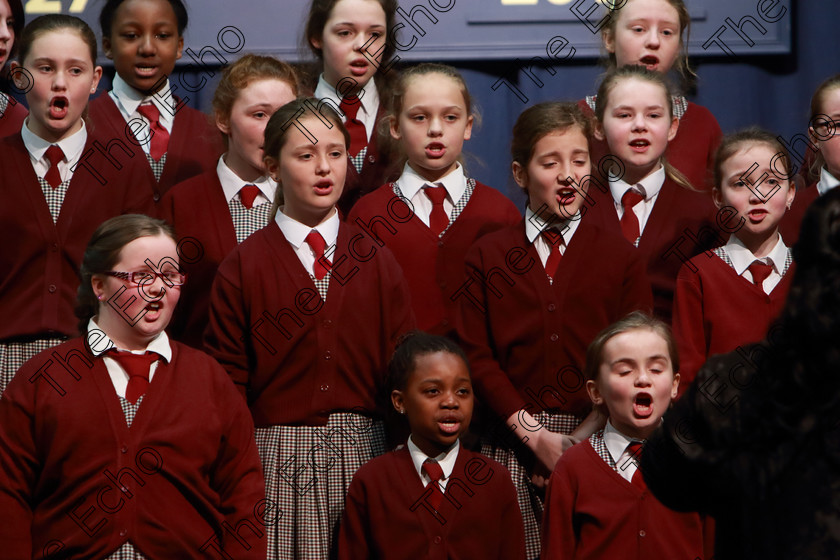 Feis12042018Thu25 
 22~27
St. Joseph Girls Choir Clonakilty singing Lord of the Dance and Listen to The Rain with Accompanist, Annabelle Adams and Conductor Joanne Walsh who went on to win the Trophy after their Bus broke down on the way to Feis. 
 Singing Class: 84: The Sr. M. Benedicta Memorial Perpetual Cup Primary School Unison Choirs Section 1 Feis Maiti 92nd Festival held in Fr. Mathew Hall. EEjob 28/03/2018 Picture: Gerard Bonus