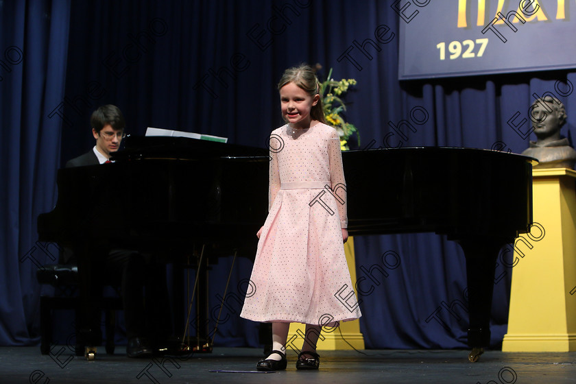 Feis27032018Tue25 
 24~25
Bronze Medal for Eliza Finn singing backed by Accompanist Michael Young.
 Singing Class: 56: 7 Years and Under Crawley The Penguin Dance Feis Maiti 92nd Festival held in Fr. Mathew Hall. EEjob 27/03/2018 Picture: Gerard Bonus