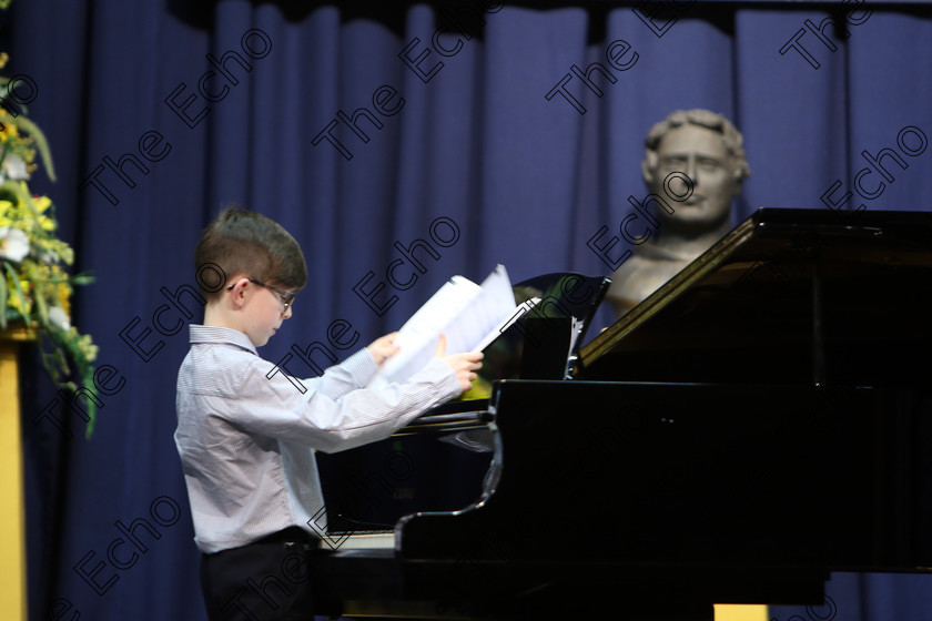 Feis02022018Fri06 
 6
Kyle ORegan fixing his Music.
 Instrumental Music Class: 187: Piano Solo 9 Years and Under Confined Feis Maiti 92nd Festival held in Fr. Matthew Hall. EEjob 02/02/2018 Picture: Gerard Bonus.