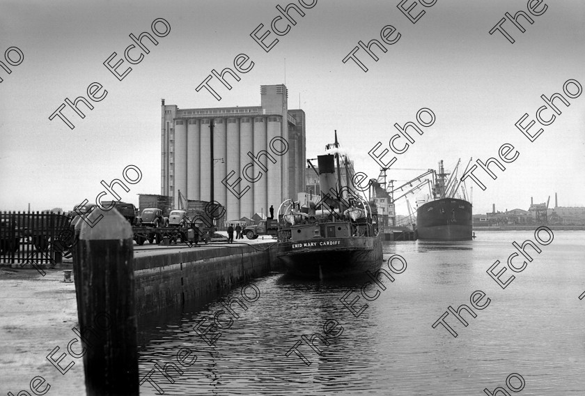 871060 871060 
 For 'READY FOR TARK'
The South Jetties, Cork showing the National Grain Silos 31/05/1953 Ref. 71G old black and white docks docklands ships quays