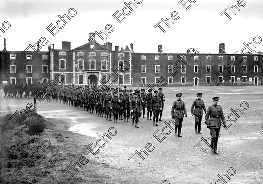 1335296 
 For 'READY FOR TARK'
Members of the Irish Free State Army take over a ruined Michael (Collins) Barracks, Old Youghal Road, Cork at the end of the Civil War in 1923 Ref. 1549 old black and white soldiers troops 
enhanced version 
 Keywords: Collins Barracks 1923