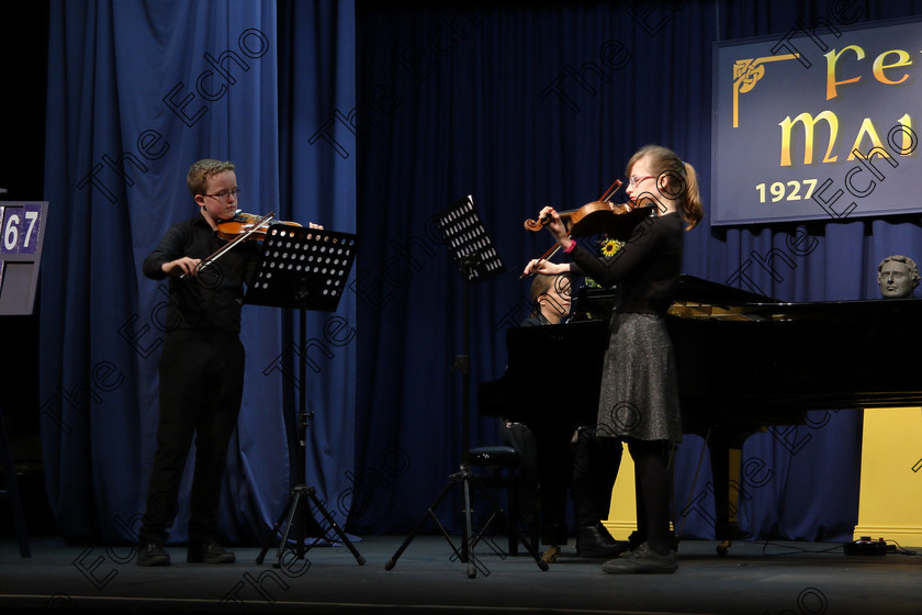 Feis01022018Thu01 
 1
Brother and Sister Duo Cillian  Cathasaigh and Niamh N Cathasaigh from Farran performing Accompanied by their mother Caroline U Cathasaigh.
 Instrumental Music Class: 267: Duo Classes and Chamber Music Junior Feis Maiti 92nd Festival held in Fr. Matthew Hall. EEjob 01/02/2018 Picture: Gerard Bonus.