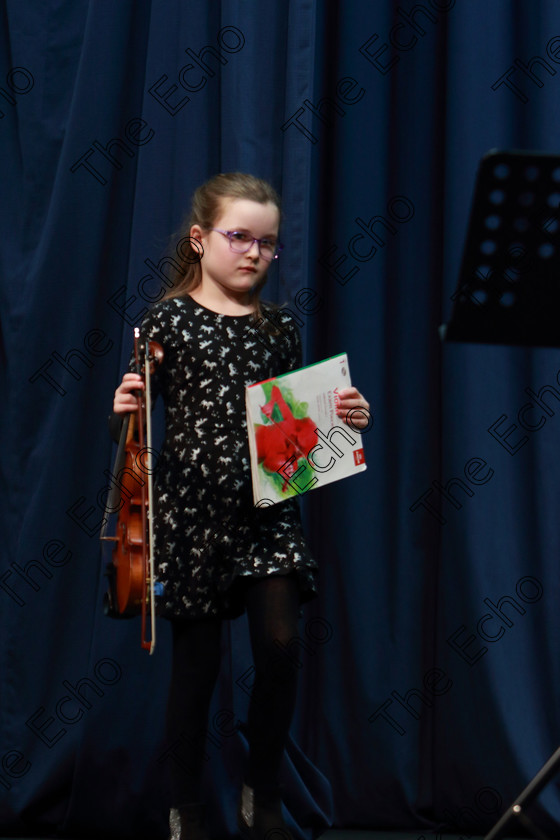 Feis0402109Mon25 
 25~26
Lily OKeeffe performing set piece.

Class: 242: Violin Solo 8 Years and Under (a) CarsePetite Reverie (Classical Carse Bk.1) (b) Contrasting piece not to exceed 2 minutes.

Feis Maiti 93rd Festival held in Fr. Matthew Hall. EEjob 04/02/2019. Picture: Gerard Bonus