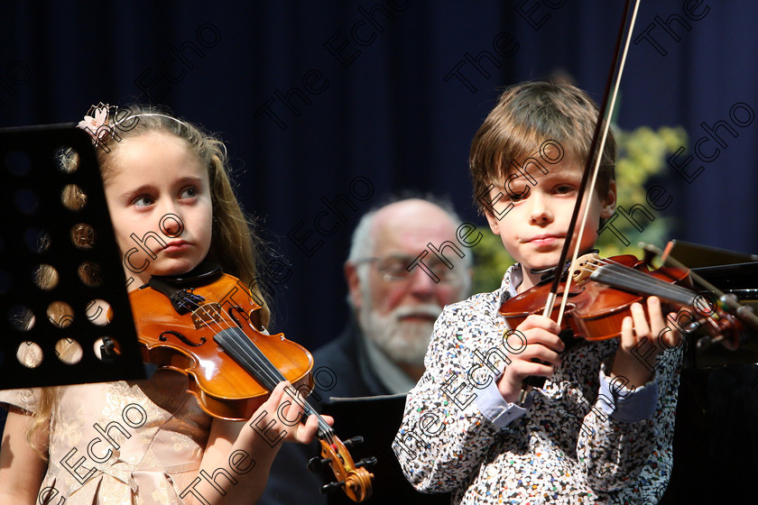 Feis29012018Mon42 
 42
Ruby Mae Sheehan Maguire and Ultan McCarthy are part of an Orchestra that Adjudicator Richard Deering set up for the performers.
 EEjob 29/01/2018 
Feis Maiti 92nd Festival held in Fr. Matthew Hall 
Picture: Gerard Bonus

Instrumental Music 
Class: 242: Violin Solo 8 years and under.