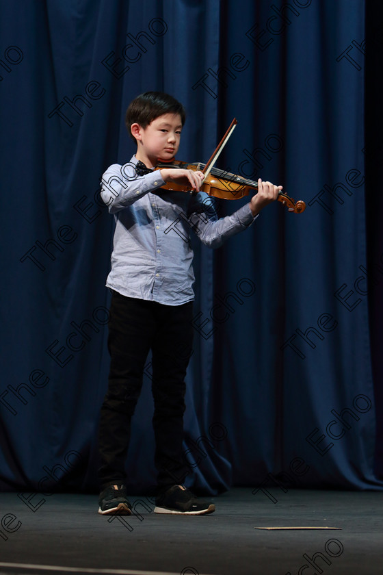 Feis0402109Mon31 
 31~32
Silver Medallist Zwyisen Bian from Limerick performing.

Class: 242: Violin Solo 8 Years and Under (a) CarsePetite Reverie (Classical Carse Bk.1) (b) Contrasting piece not to exceed 2 minutes.

Feis Maiti 93rd Festival held in Fr. Matthew Hall. EEjob 04/02/2019. Picture: Gerard Bonus