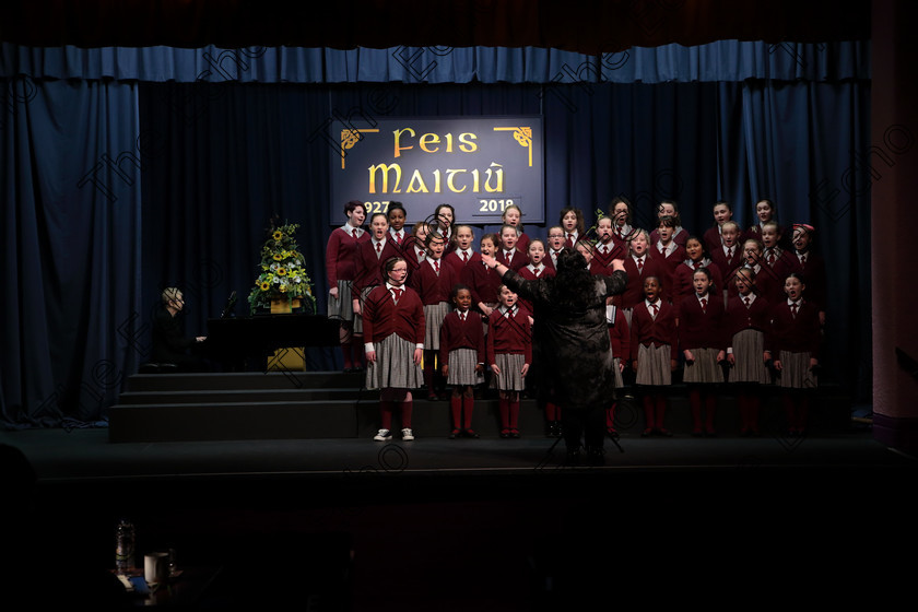 Feis12042018Thu23 
 22~27
St. Joseph Girls Choir Clonakilty singing Lord of the Dance and Listen to The Rain with Accompanist, Annabelle Adams and Conductor Joanne Walsh who went on to win the Trophy after their Bus broke down on the way to Feis. 
 Singing Class: 84: The Sr. M. Benedicta Memorial Perpetual Cup Primary School Unison Choirs Section 1 Feis Maiti 92nd Festival held in Fr. Mathew Hall. EEjob 28/03/2018 Picture: Gerard Bonus