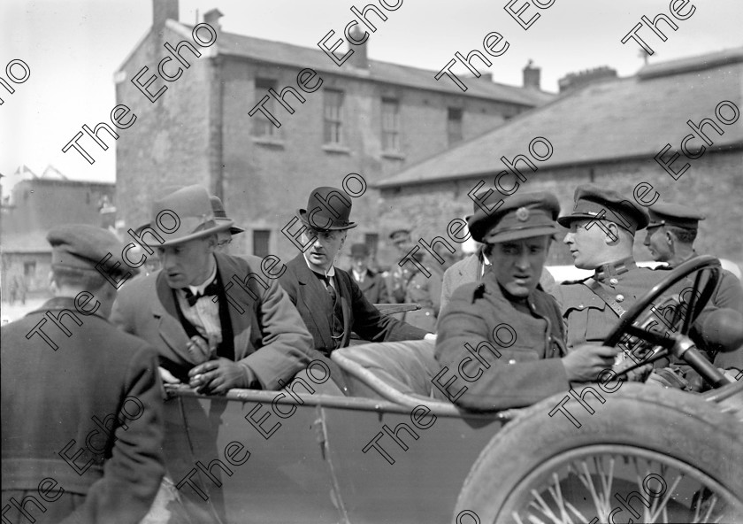 1176065 
 Members of the Irish Free State Army take over a ruined Michael (Collins) Barracks, Old Youghal Road, Cork at the conclusion of the Civil War in 1923. In bowler hat is President of the Executive Council of Ireland William (W.T.) Cosgrave Ref. 1549 old black and white soldiers troops