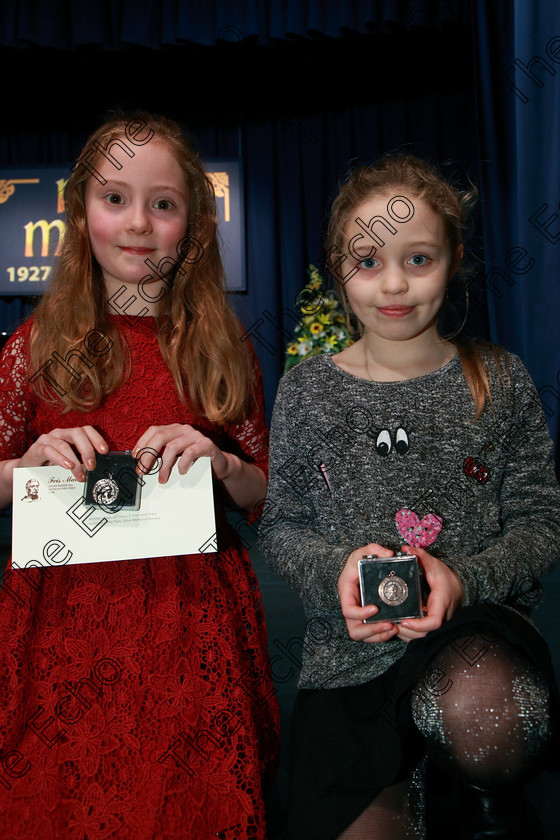 Feis07022018Wed12 
 12
Silver Medallist Georgina Ellen Hynes McLaughlin and Bronze Medallist Caoimhe Owen.
 Instrumental Music Class: 167: Piano Solo8 Years and Under Feis Maiti 92nd Festival held in Fr. Mathew Hall. EEjob 05/02/2018 Picture: Gerard Bonus.